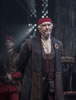 Shylock in bluish and redish robes, burgundy vest and white shirt plus red skullcap and hands behind his back, Prince in black robe behind him, guard in leather waiste coat and red breeches, light streaming through the grate of the back wall.